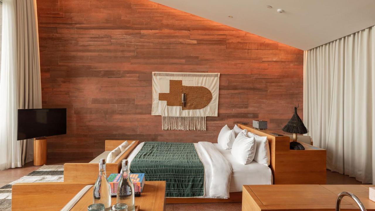 סמיניאק Potato Head Suites & Studios מראה חיצוני תמונה A bedroom at the hotel